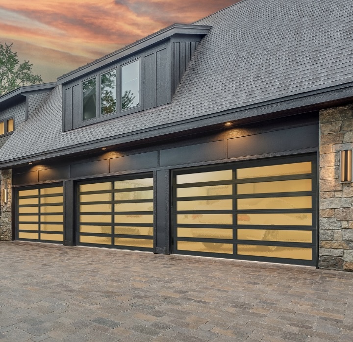 Modern home with full-view glass garage doors serviced across Southwest Florida